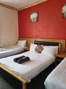 En eller flere senger på et rom på Tulip Hotel Blackpool