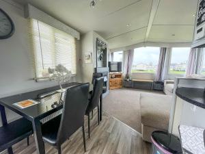 a living room with a dining room table and chairs at Modern 6 Berth Caravan For Hire At Fantasy Island In Skegness Ref 58009d in Skegness