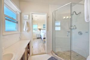 a bathroom with a shower and a sink at Villa Jules, Oceanfront, Private Beach, Fire Pit in Oceanside +31 photos