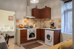 a kitchen with a washing machine and a washer at Feneri- cozy Apartment 20' from Elafonisi beach in Elafonisi