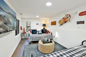 a living room with a couch and a table at Soaring Pines by Big Bear Vacations Central Cozy Estate Chalet in Big Bear Lake