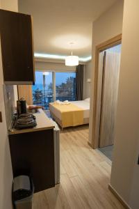 Postel nebo postele na pokoji v ubytování Nikolaidis Apartments
