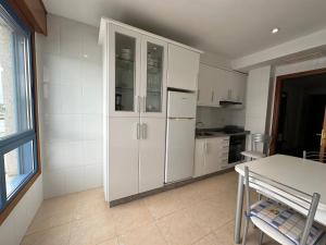 Kuchyň nebo kuchyňský kout v ubytování Apartamento Salgueirón