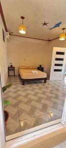 a bedroom with a bed in a room at Casa Choco in Mazunte