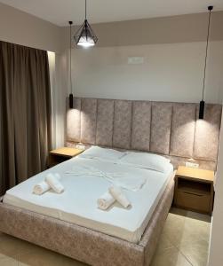 Postel nebo postele na pokoji v ubytování Karos Hotel Llaman