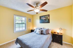 a bedroom with a bed and a ceiling fan at Cozy Lexington Townhome about 3 Mi to UK Campus! in Lexington