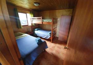Postel nebo postele na pokoji v ubytování Cabañas Christophe