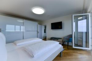 En eller flere senge i et værelse på Am Sahlenburger Strand AS23 + 26 billeder