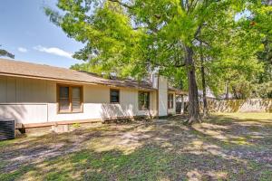 a house with a tree in the yard at Fayetteville Vacation Rental with Yard! in Fort Bragg