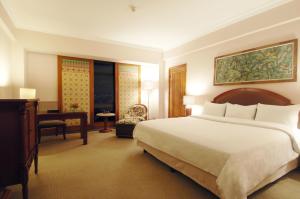 Postel nebo postele na pokoji v ubytování The Sultan Hotel & Residence Jakarta