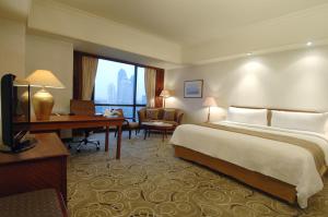 Postel nebo postele na pokoji v ubytování The Sultan Hotel & Residence Jakarta
