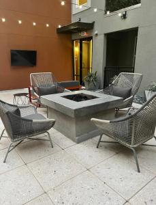 a patio with chairs and a fire pit in a building at Luxury Apartment in Downtown Las Vegas in Las Vegas