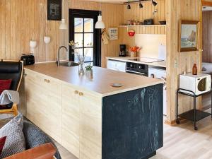 a kitchen with a large island in a room at Holiday home Hadsund CXLIII in Hadsund