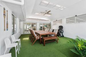 a dining room with a table and chairs at The Sunrise Cubby House in Sunrise Beach