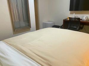 Jisco Hotel Obama Onsen客房内的一张或多张床位