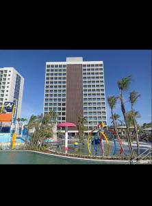 a large building with a water park in front of it at Salinas Premium Resort in Salinópolis
