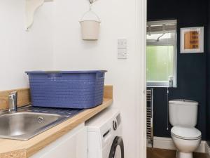 a small bathroom with a sink and a toilet at The Kingsway in Ilkley