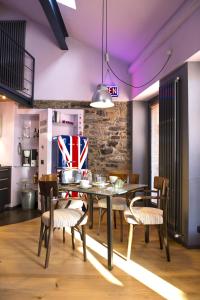 a dining room with a table and chairs at Casa Rossa - byMyHomeinComo in Cernobbio