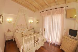 Postel nebo postele na pokoji v ubytování Villa Romantica