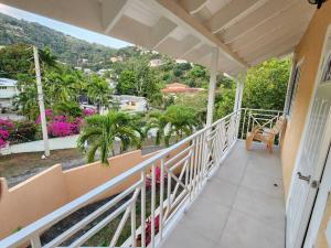 a balcony of a house with a view at Spacious Luxury 3 Bed Rooms in Kingston in Kingston