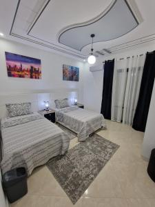 Katil atau katil-katil dalam bilik di Fabuleux Appart a Larache avec confort exceptionnel et propreté souhaitée