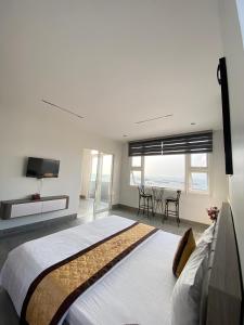 Giường trong phòng chung tại Sao Mai Hotel & Apartment