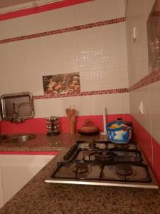 a kitchen counter with a stove top in a kitchen at JERDOUH For FAMILY ONLY in Tetouan