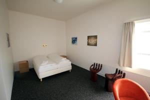 Postel nebo postele na pokoji v ubytování Höfn Inn Guesthouse