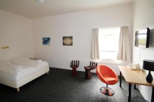 Postel nebo postele na pokoji v ubytování Höfn Inn Guesthouse