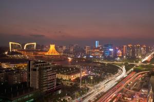 a city lit up at night with traffic at Nanning Marriott Hotel in Nanning