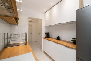 Kuchyň nebo kuchyňský kout v ubytování Apartments Slavica