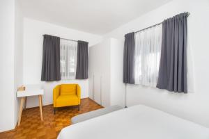 Postel nebo postele na pokoji v ubytování Apartments Slavica