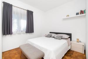 Postel nebo postele na pokoji v ubytování Apartments Slavica