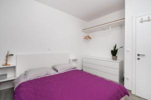 Postel nebo postele na pokoji v ubytování Apartments Slavica