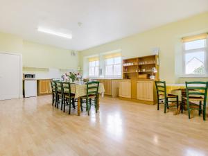 a kitchen and dining room with a table and chairs at The Knock in Inverey