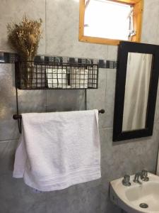 a bathroom with a sink and a white towel at Bastian in Mercedes