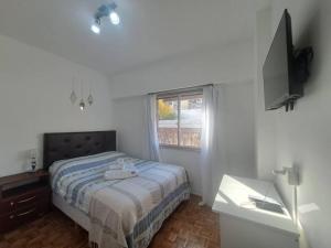 מיטה או מיטות בחדר ב-Cómodo y completo apartamento en Buenos Aires ideal grupos grandes familias