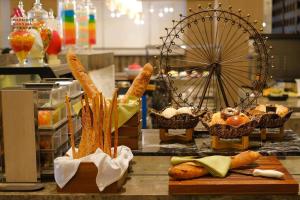 a counter with baskets of food and baskets of bread at Nanning Marriott Hotel in Nanning