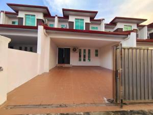 a house with a gate in front of it at Sakura homestay 5 bedrooms - Spring Lopeng 14 pax in Miri