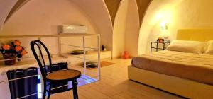 A bed or beds in a room at Guglielmo Tell Suite