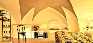 A bed or beds in a room at Guglielmo Tell Suite