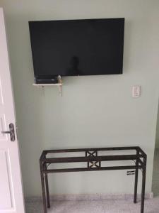 Televisyen dan/atau pusat hiburan di Casa bem localizada