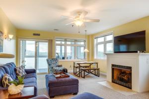 a living room with a couch and a fireplace at Lakefront Huddleston Condo with Community Pool in Huddleston