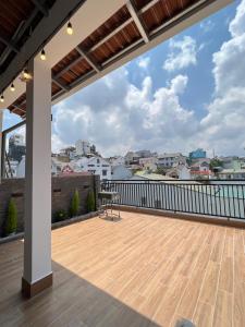 a roof deck with a view of a city at Su Apartment in Da Lat