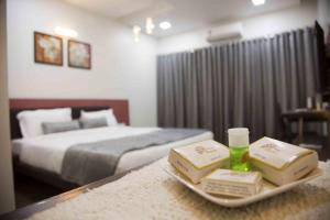 Postel nebo postele na pokoji v ubytování Hotel Pearls