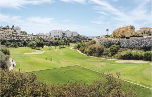 a view of the golf course at a resort at Cozy Apartment In Mijas With Swimming Pool in Mijas +14 photos