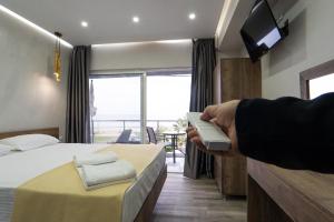 TV a/nebo společenská místnost v ubytování Nikolaidis Apartments