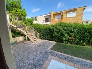 a stairway leading to a house with a building at Villa with Roof, Private Garden and Backyard in North Coast - Families Only فيلا مستقلة الساحل الشمالي - عائلات فقط in Dawwār Abū Maḩrūs