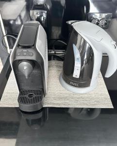 a blender and a toaster sitting on a counter at Budget Luxury Apartment - Absolutely New Building! in Ruse
