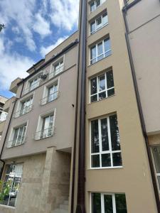 a building with a pole in front of it at Budget Luxury Apartment - Absolutely New Building! in Ruse